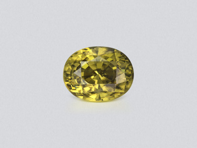 Ein leuchtender, grünlich-gelber zirkon im ovalschliff 3,98 karat, Sri Lanka photo