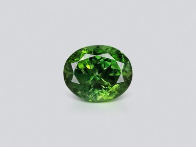 Intense green zircon in oval cut 6.40 carats photo