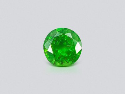 Uraler Demantoid mit Pferdeschwanzeinschluss 0,58 Karat photo