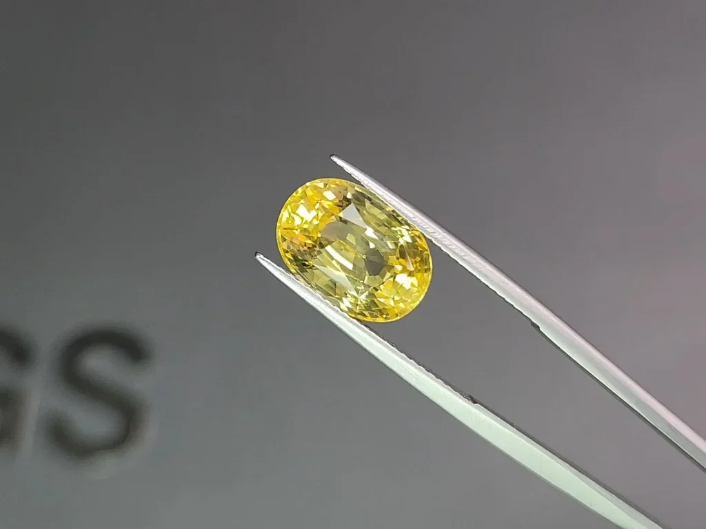 Untreated vivid yellow sapphire in oval cut 8.05 carats, Sri Lanka Image №3