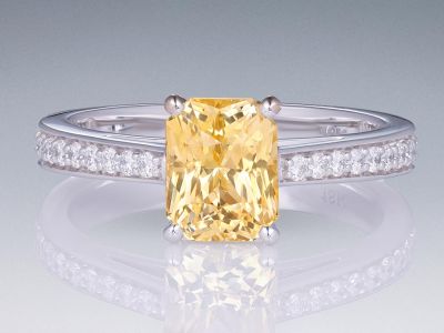 Ring with 2.06 ct yellow sapphire and diamonds in 18K white gold photo