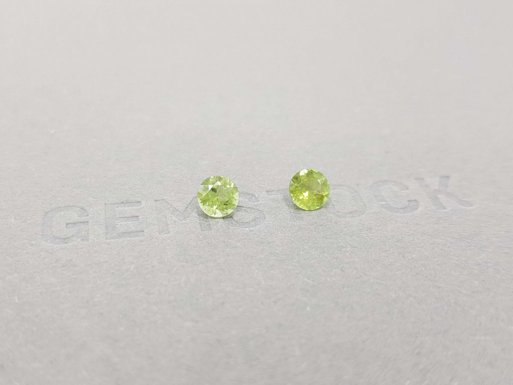 A pair of bright green tourmalines in a 5 mm round cut Image №3