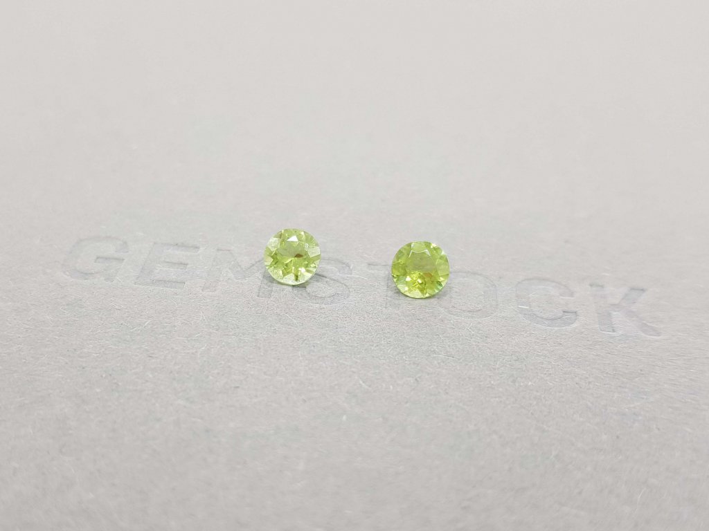 A pair of bright green tourmalines in a 5 mm round cut Image №2