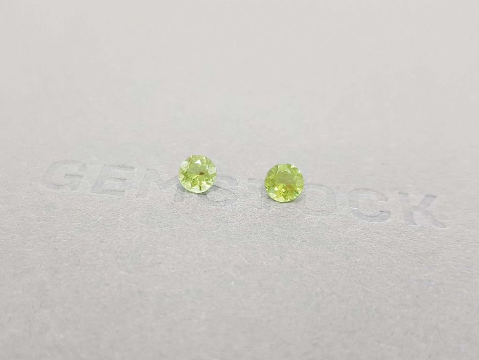 A pair of bright green tourmalines in a 5 mm round cut Image №2