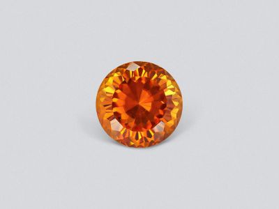 Vivid orange clinohumite 3.88 carats in round cut, Afghanistan photo