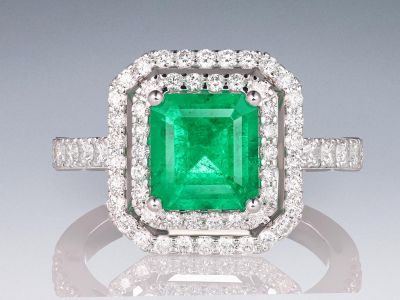 Ring with 1.85 carat Muzo Green emerald and diamonds in 18K white gold photo