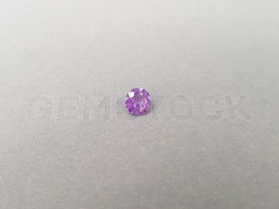 Untreated violet sapphire from Madagascar in round cut 0.91 ct photo